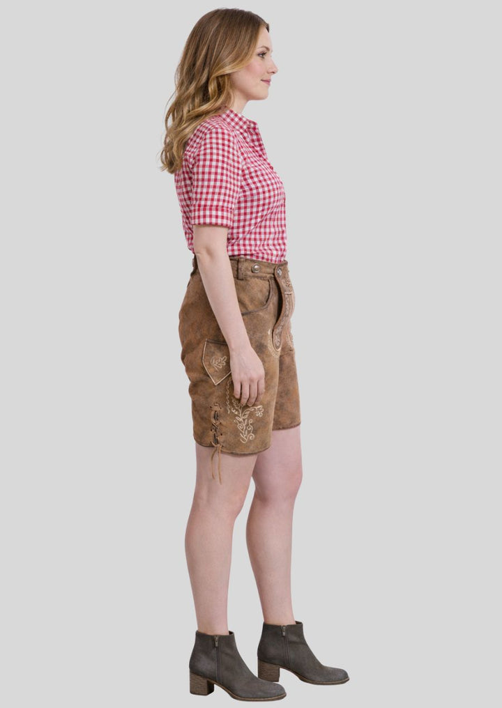 Seitenansicht einer braunen Damen Lederhose mit floraler Stickerei
